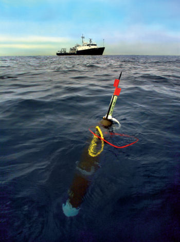 Berkeley Lab researchers test an earlier version of the robotic float used to measure carbon dynamics in the ocean. The R/V New Horizon is in the background. (Credit: Roy Kaltschmidt/Berkeley Lab)