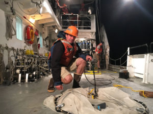 Mike Stukel of Florida State University prepares his gear for an evening "plankton tow." (Photo: Sarah Yang)